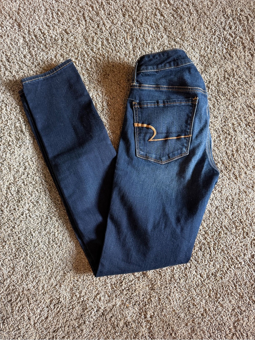 American Eagle Outfitters Dark Navy Skinny Jeans with Tan Stitching